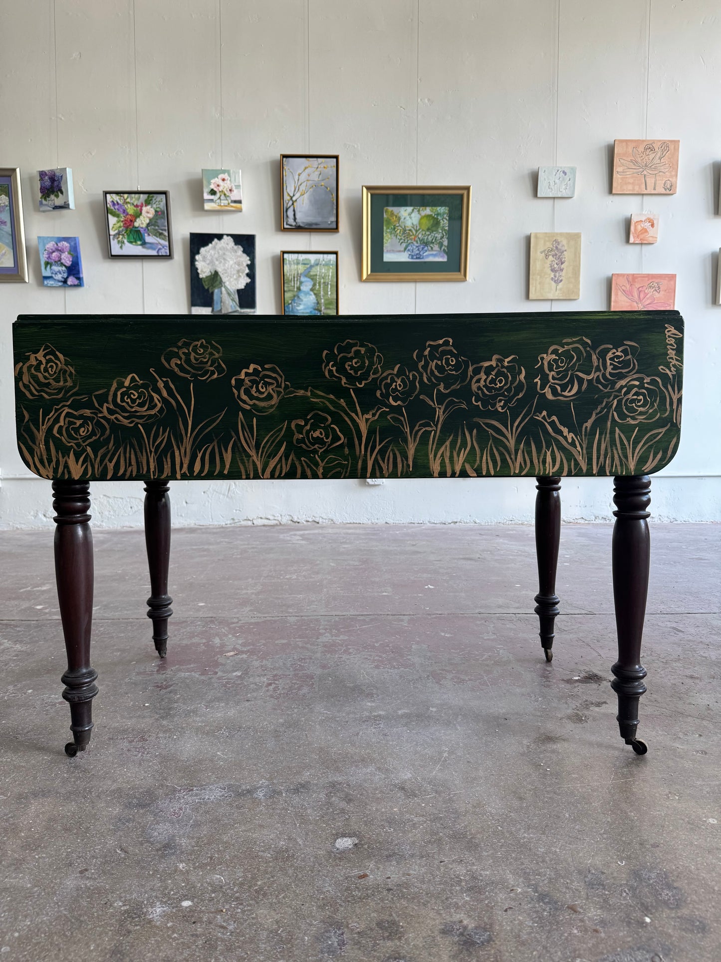 “Enchanted Meadow” by Dorothy Collier, mixed media on vintage drop leaf game table