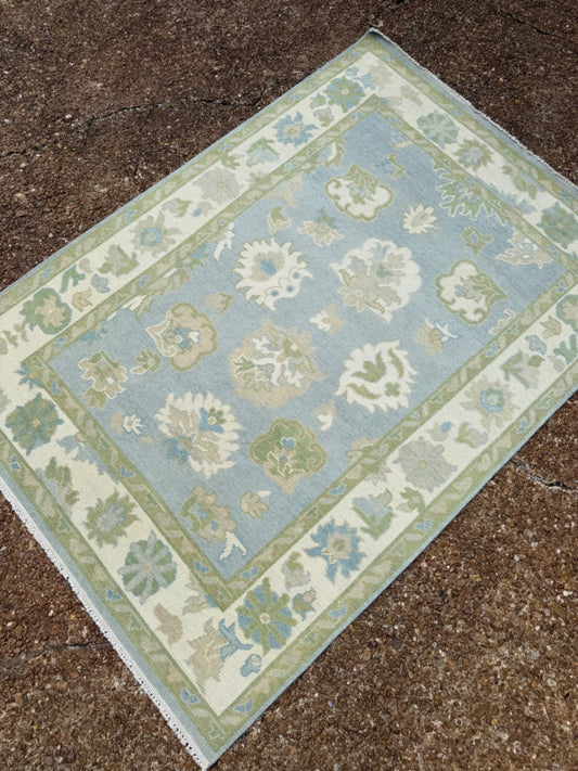 Oushak rug, 5’ x 7’, blue base, green, cream