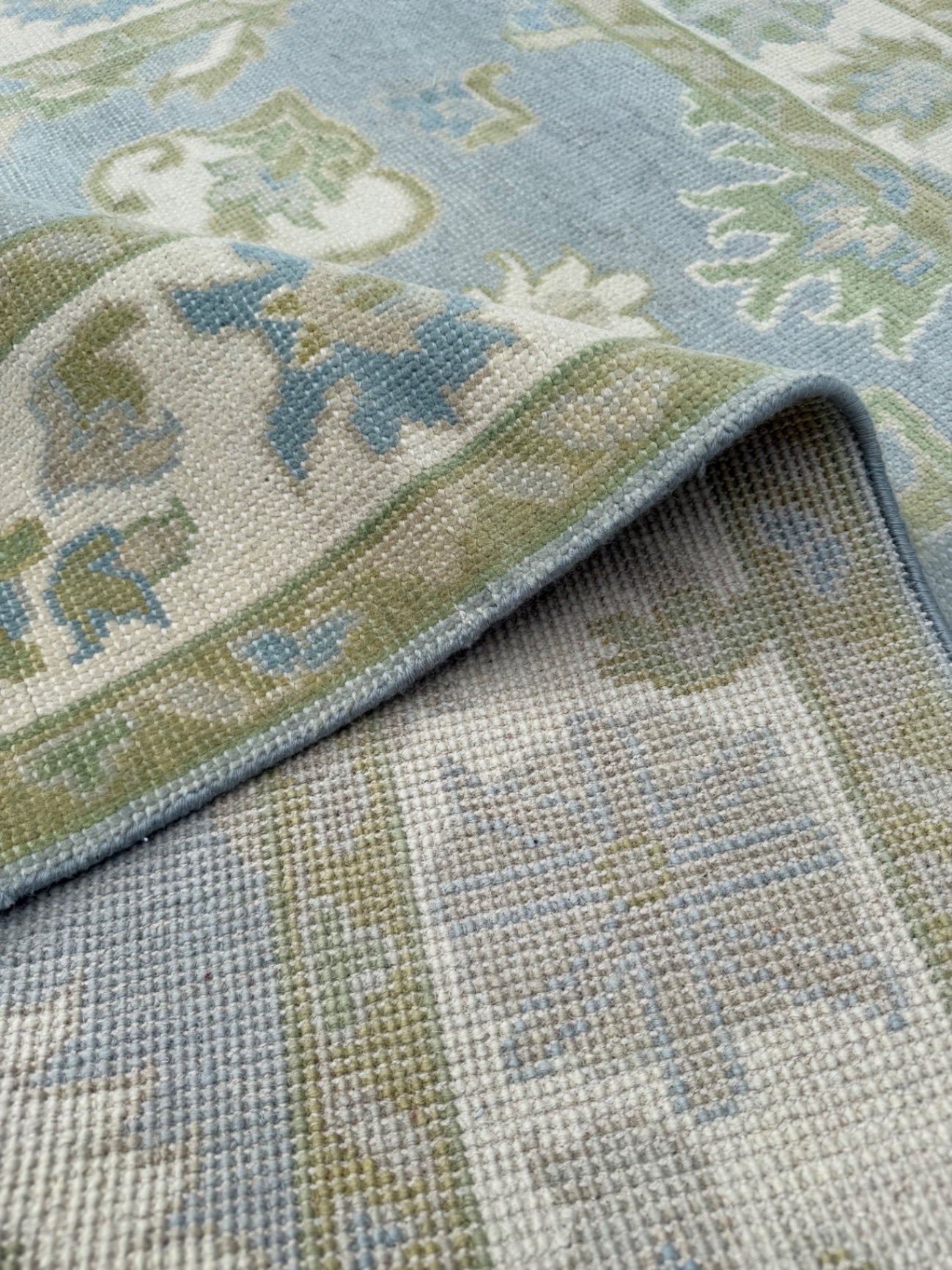Oushak rug, 5’ x 7’, blue base, green, cream