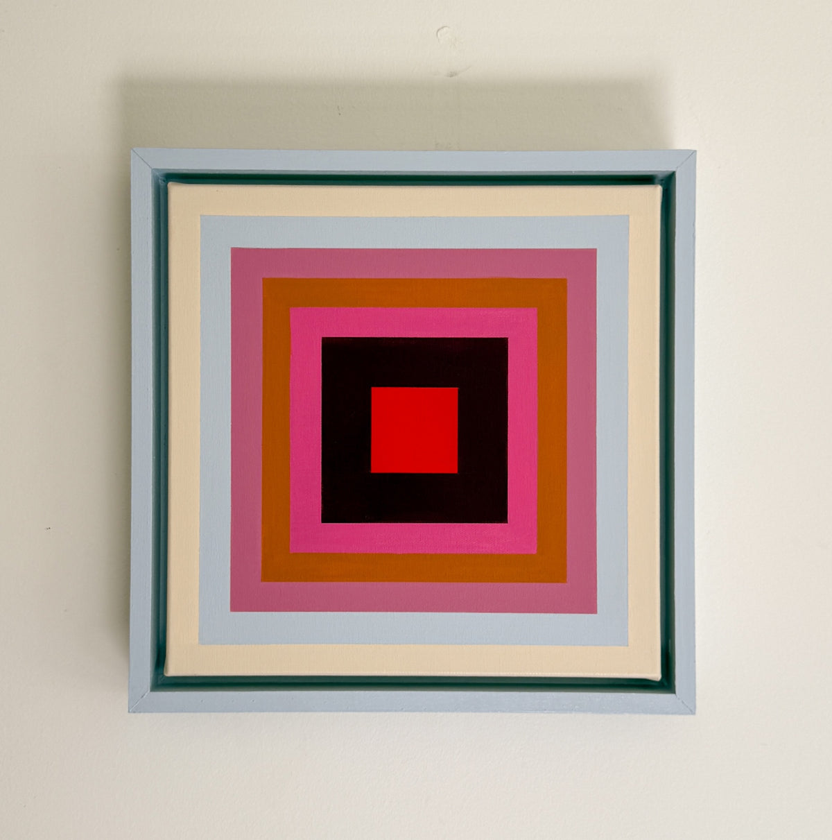 “Little Color Echo- Red” by Rebecca Dodson, acrylic on canvas mounted in float frame, 12”x12”