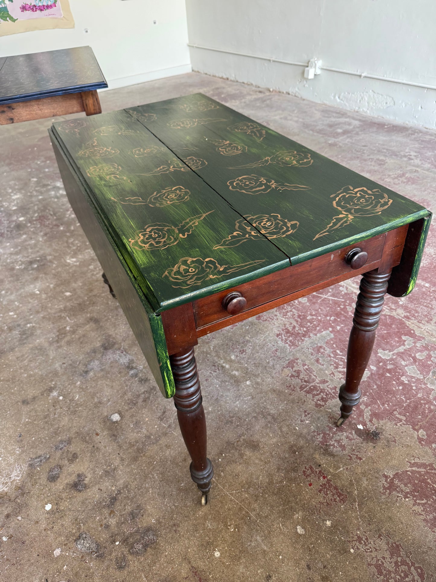 “Enchanted Meadow” by Dorothy Collier, mixed media on vintage drop leaf game table
